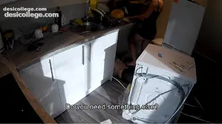 Horny wife seduces a plumber in the kitchen while her husband at work.