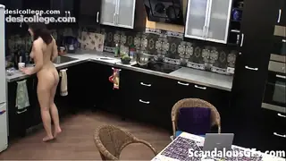 Premium My hot tattooed GF cooking breakfast naked