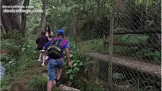 Threesome in the woods with two pretty girls .